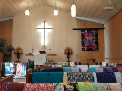 Quilts on pews